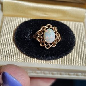 10k flashy opal ring size 5 1/4. Sizeable.  Stamped 10k. Amazing color flashes!